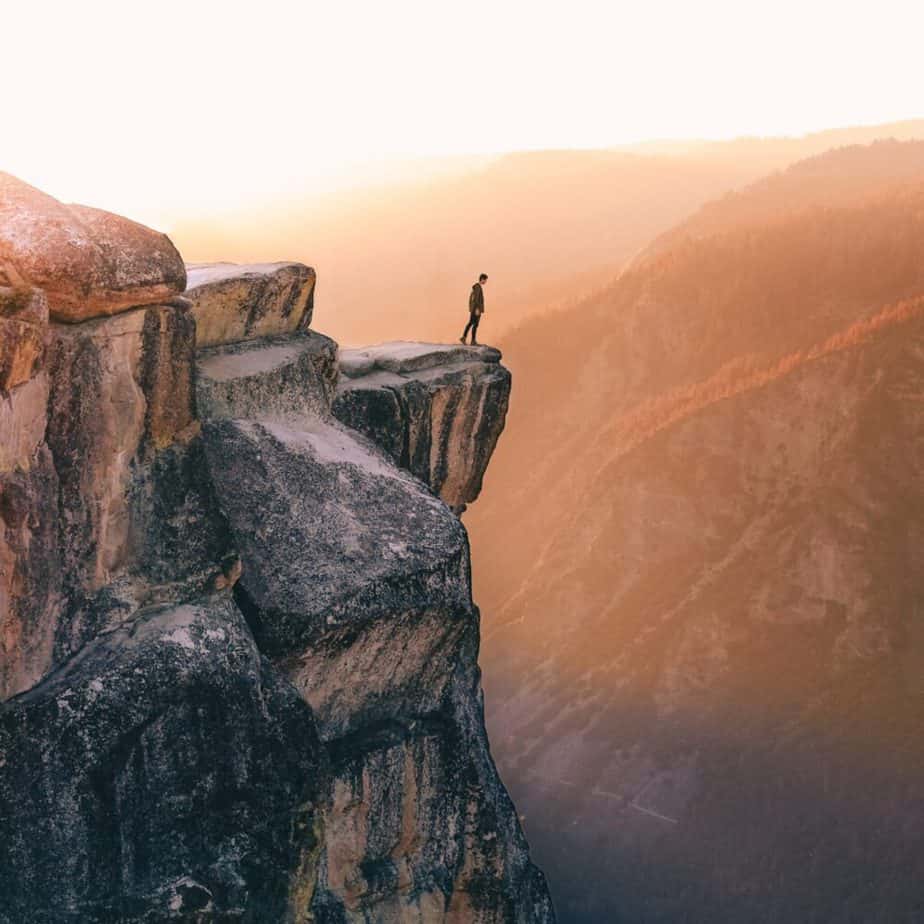 Fear Setting - Man standing on edge of cliff