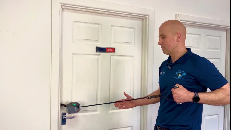 GoTone Pro attached to a door anchor demonstrated by physiotherapist Chris Tiley
