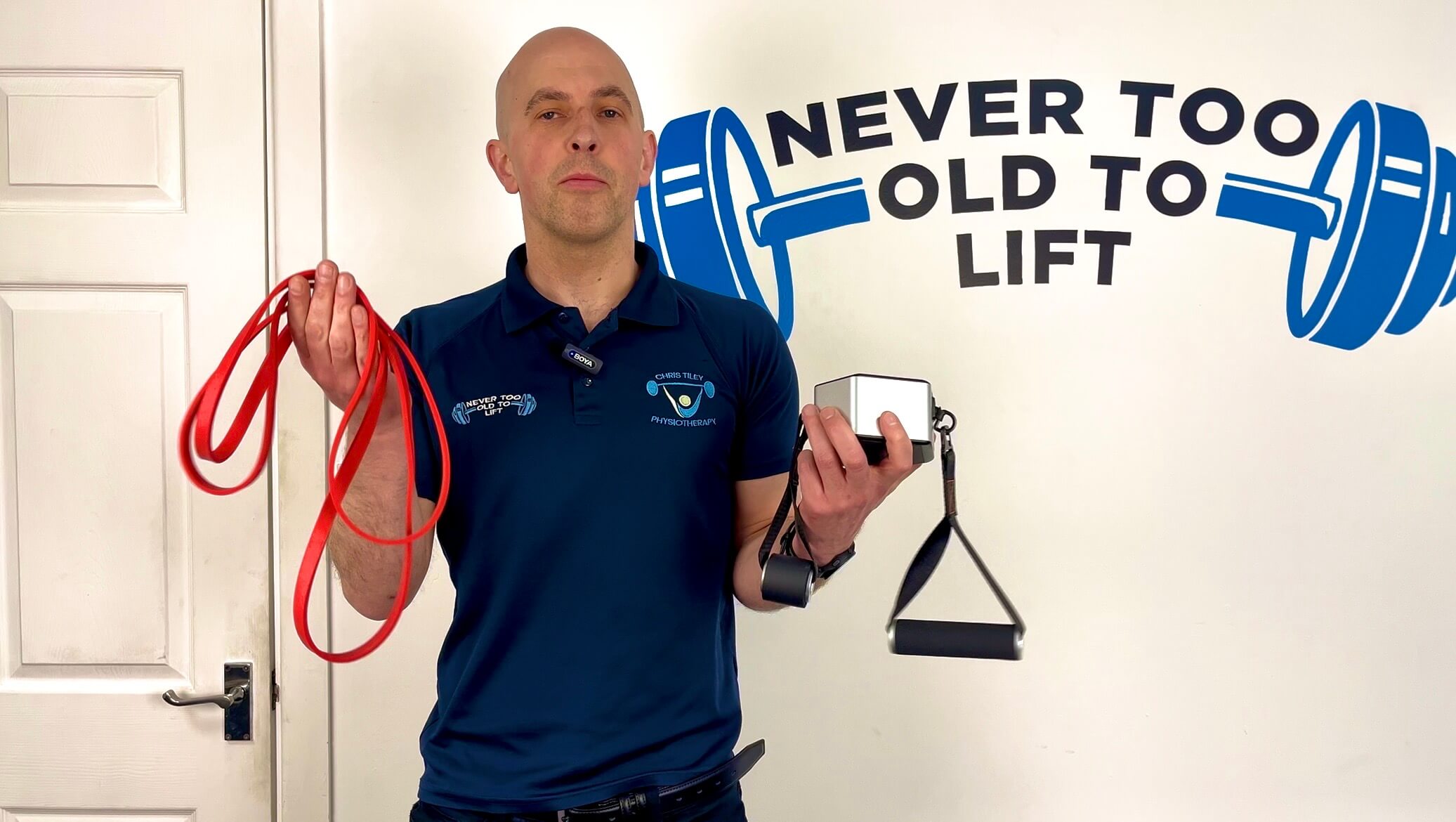 Physiotherapist Chris Tiley comparing the GoTone Pro portable cable machine with a resistance band